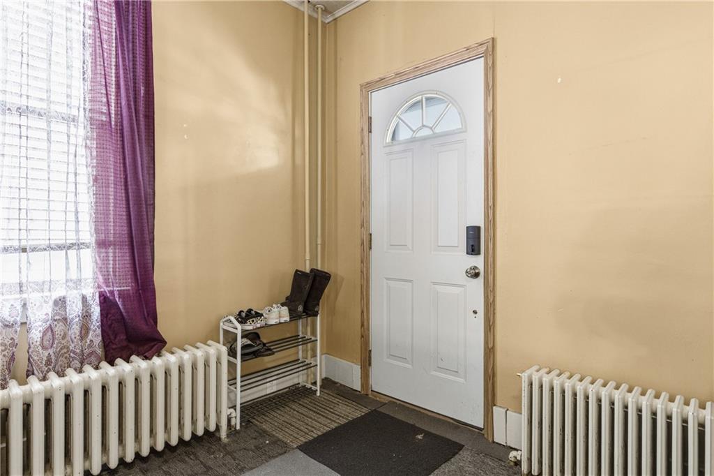 526 Dippold Avenue Baden, PA 15005 - Photo 6 of 26 a bedroom with a bed and a window