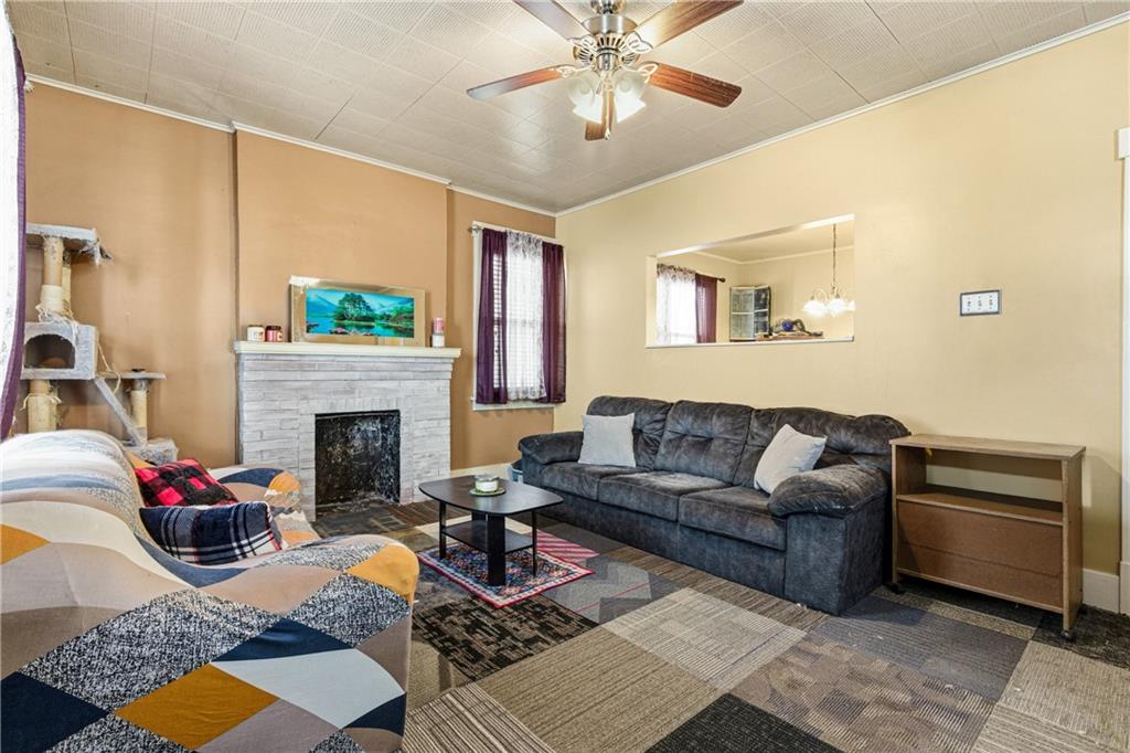 526 Dippold Avenue Baden, PA 15005 - Photo 7 of 26 a living room with furniture and a fireplace