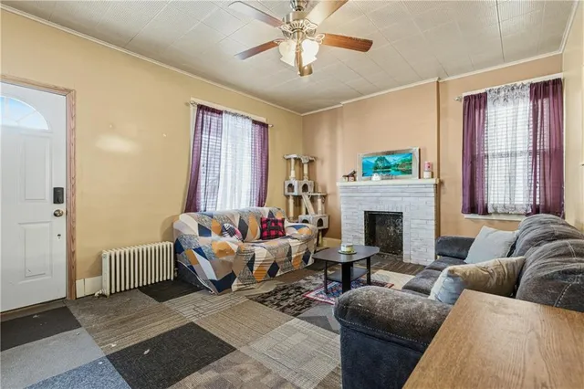 a living room with furniture and a fireplace
