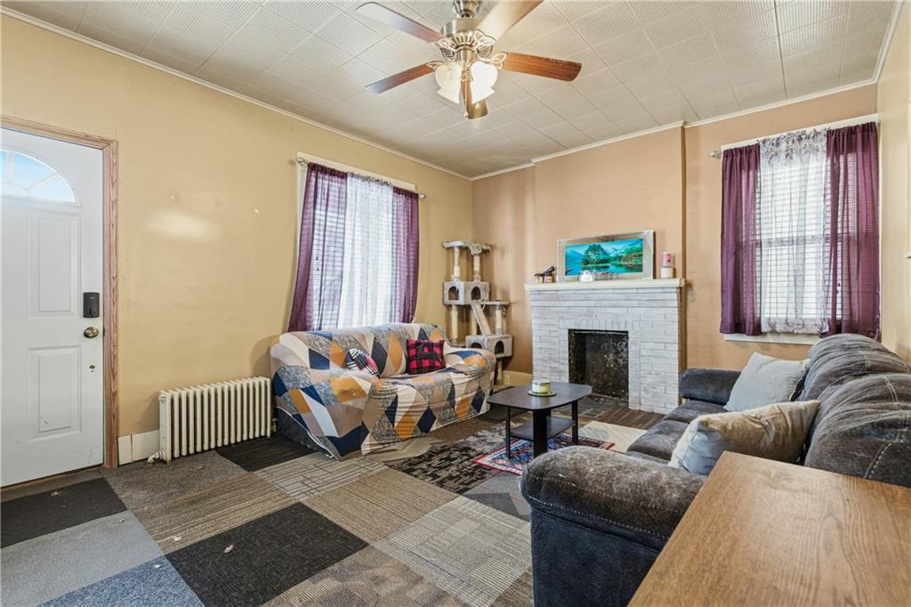 526 Dippold Avenue Baden, PA 15005 - Photo 8 of 26 a living room with furniture and a fireplace
