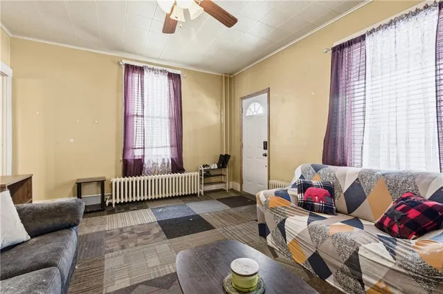 a living room with furniture and a window
