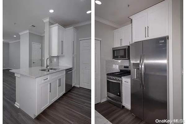 a kitchen with stainless steel appliances and a refrigerator