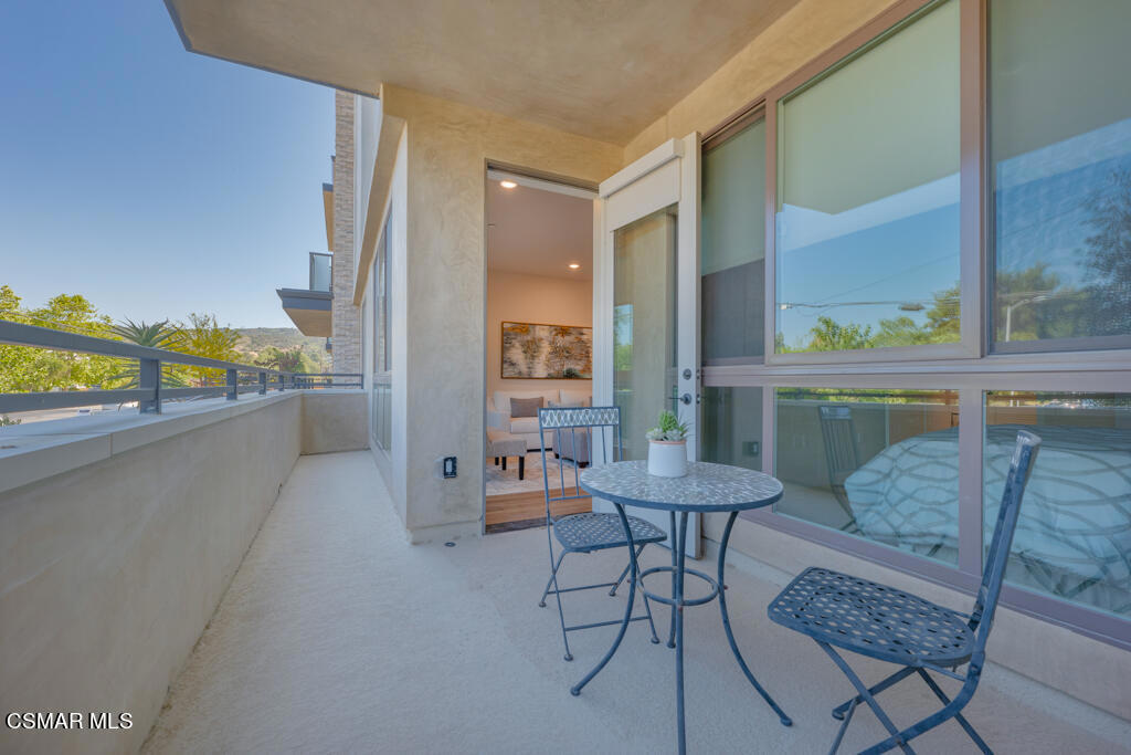 77 North Conejo School Road, Unit 208 Thousand Oaks, CA 91362 - Photo 15 of 27 a room with furniture and a large window