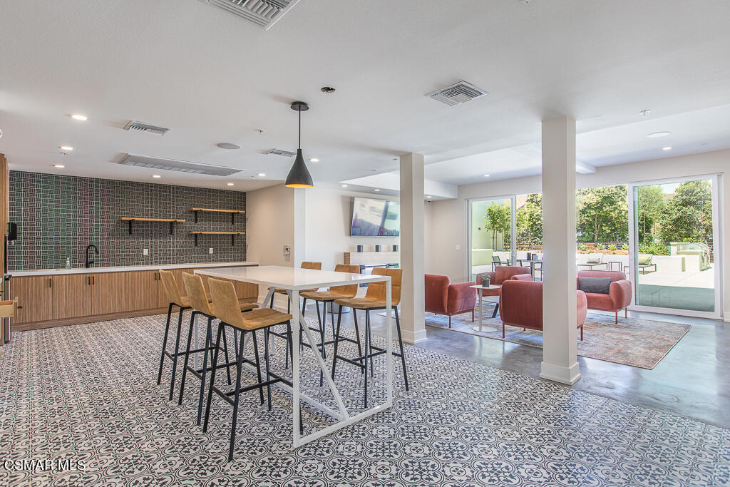 77 North Conejo School Road, Unit 208 Thousand Oaks, CA 91362 - Photo 17 of 27 a view of a dining room with furniture window and outside view