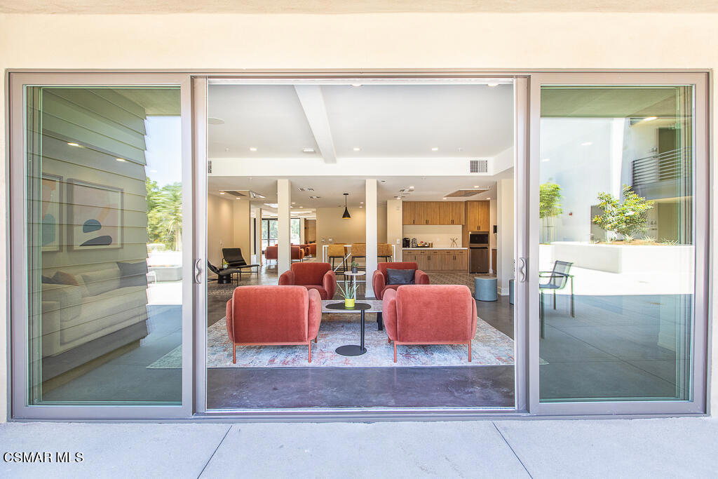 77 North Conejo School Road, Unit 208 Thousand Oaks, CA 91362 - Photo 19 of 27 a room with two lamp and large window