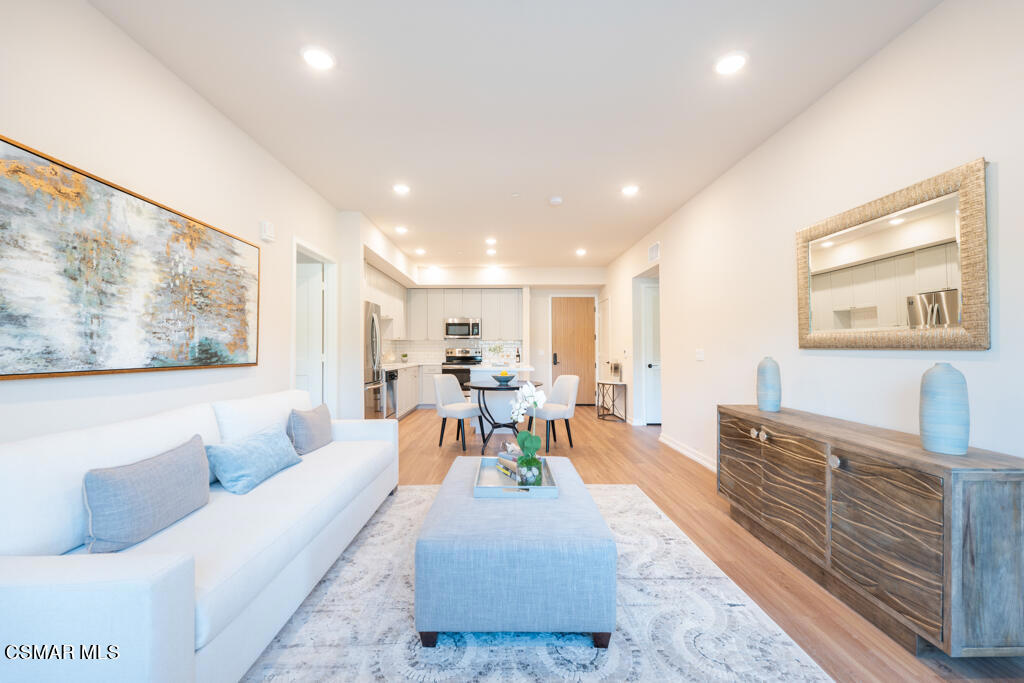 77 North Conejo School Road, Unit 208 Thousand Oaks, CA 91362 - Photo 4 of 27 a living room with furniture and a large window