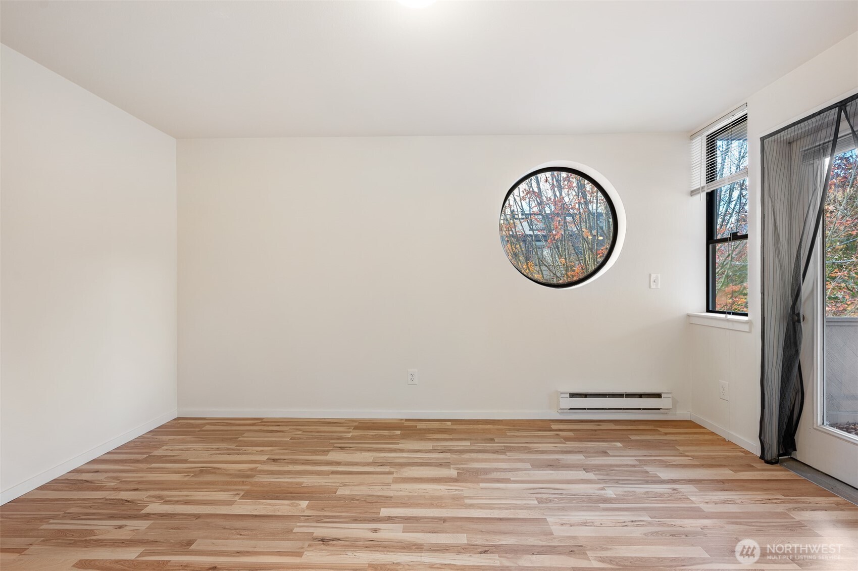 802 North 43rd Street Seattle, WA 98103 - Photo 16 of 18 a view of a room with wooden floor and a window