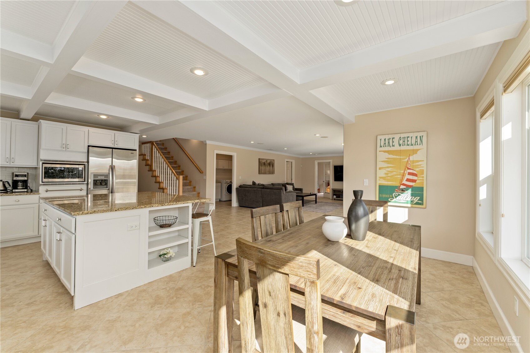 60 Wall Street Manson, WA 98831 - Photo 11 of 40 a view of a dining room with furniture a kitchen and chandelier
