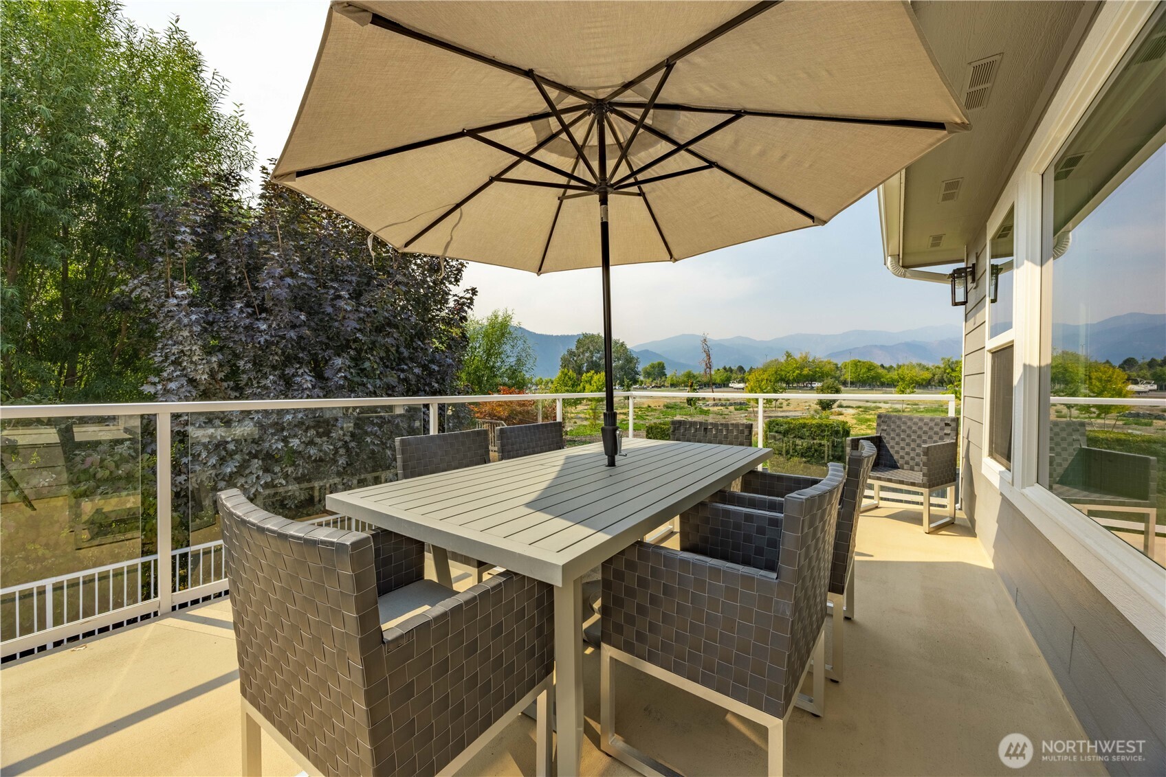 60 Wall Street Manson, WA 98831 - Photo 13 of 40 a view of a roof deck with furniture and barbeque grill