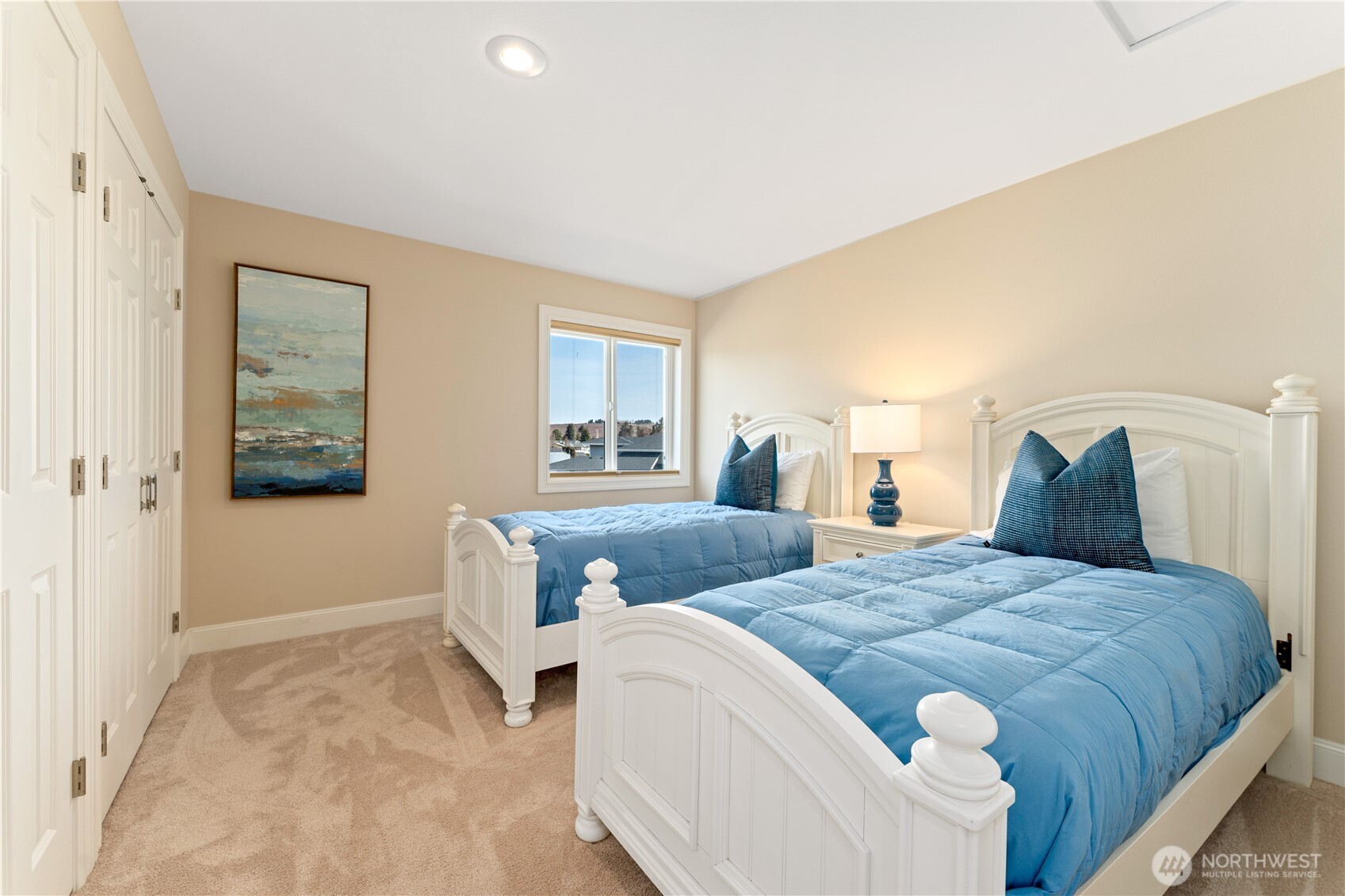 60 Wall Street Manson, WA 98831 - Photo 23 of 40 a bedroom with a bed and a couch