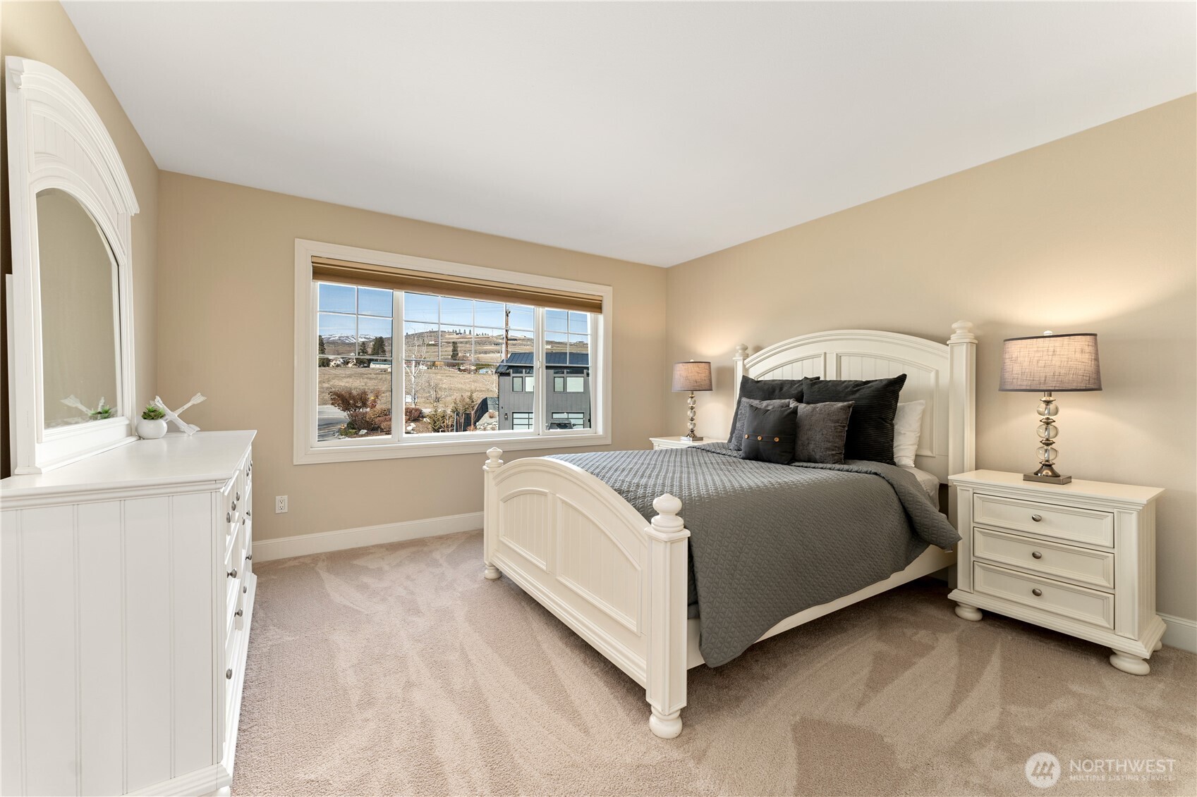 60 Wall Street Manson, WA 98831 - Photo 24 of 40 a bedroom with a large bed and a window