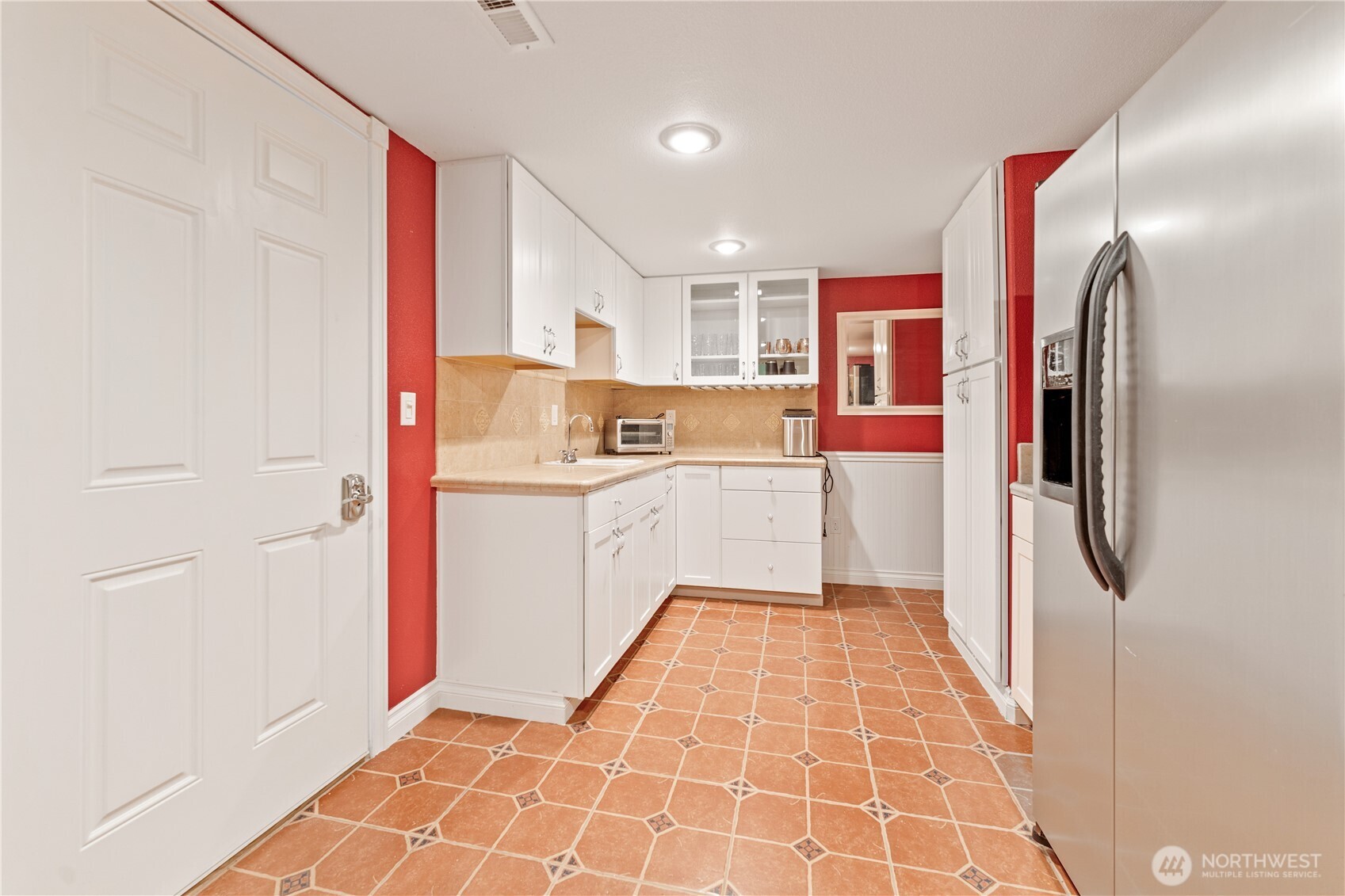 60 Wall Street Manson, WA 98831 - Photo 34 of 40 a kitchen with stainless steel appliances a refrigerator and a sink