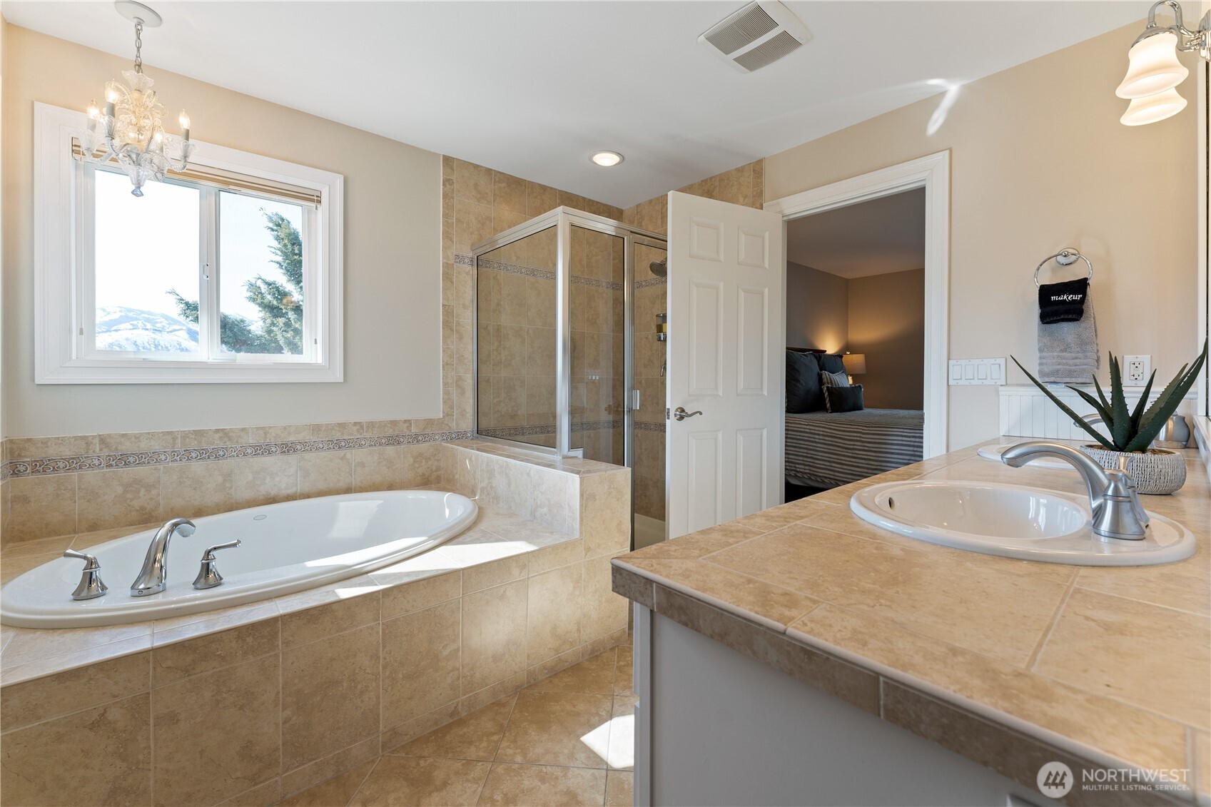 60 Wall Street Manson, WA 98831 - Photo 8 of 40 a bathroom with a tub a sink and mirror