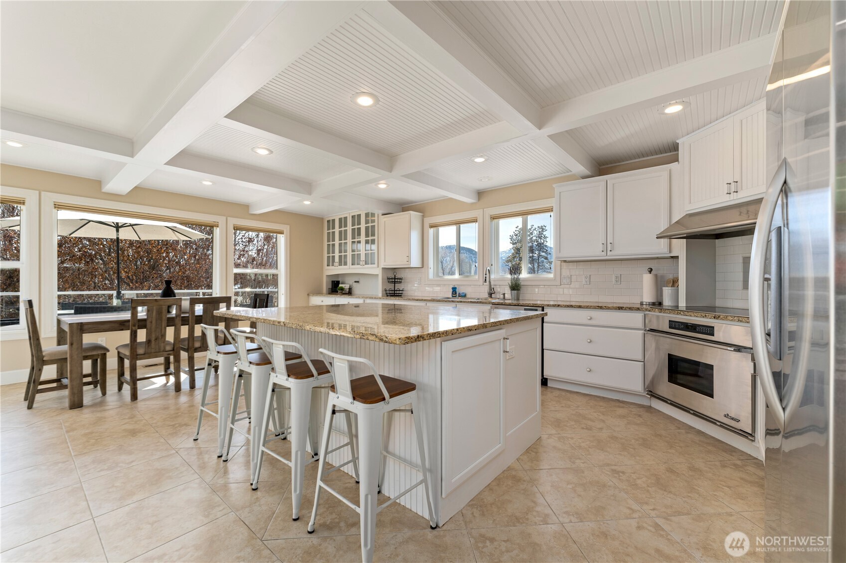 60 Wall Street Manson, WA 98831 - Photo 9 of 40 a kitchen with appliances a sink a counter top space and a center island