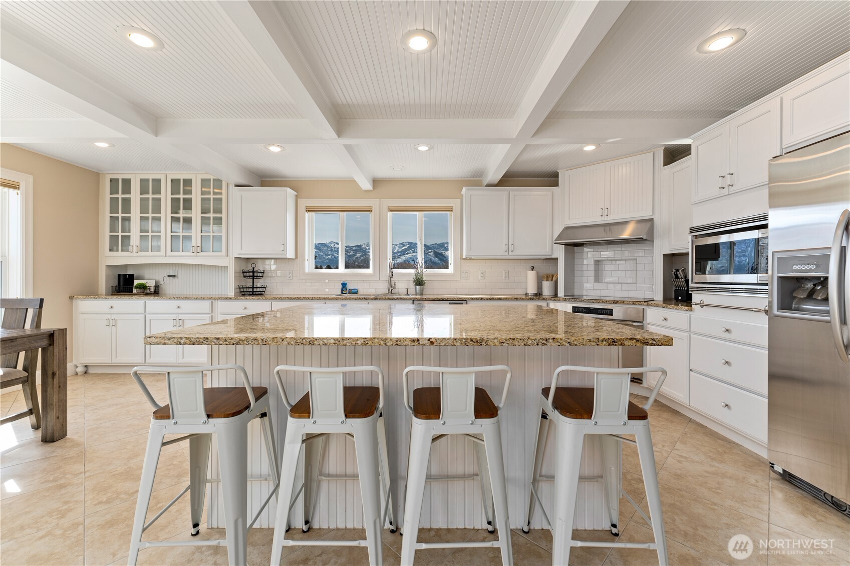 60 Wall Street Manson, WA 98831 - Photo 10 of 40 a large kitchen with stainless steel appliances granite countertop a stove and a refrigerator