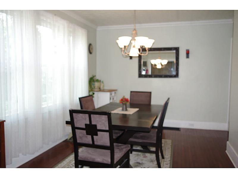 Dining Room. Formal Dining room features gleaming hard wood floors and plenty of space for all your entertaining needs.