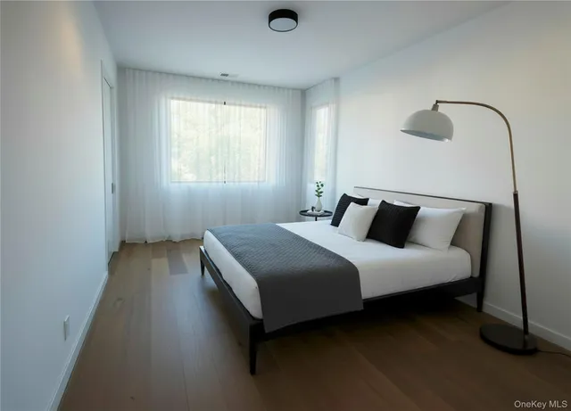 a bedroom with bed and window