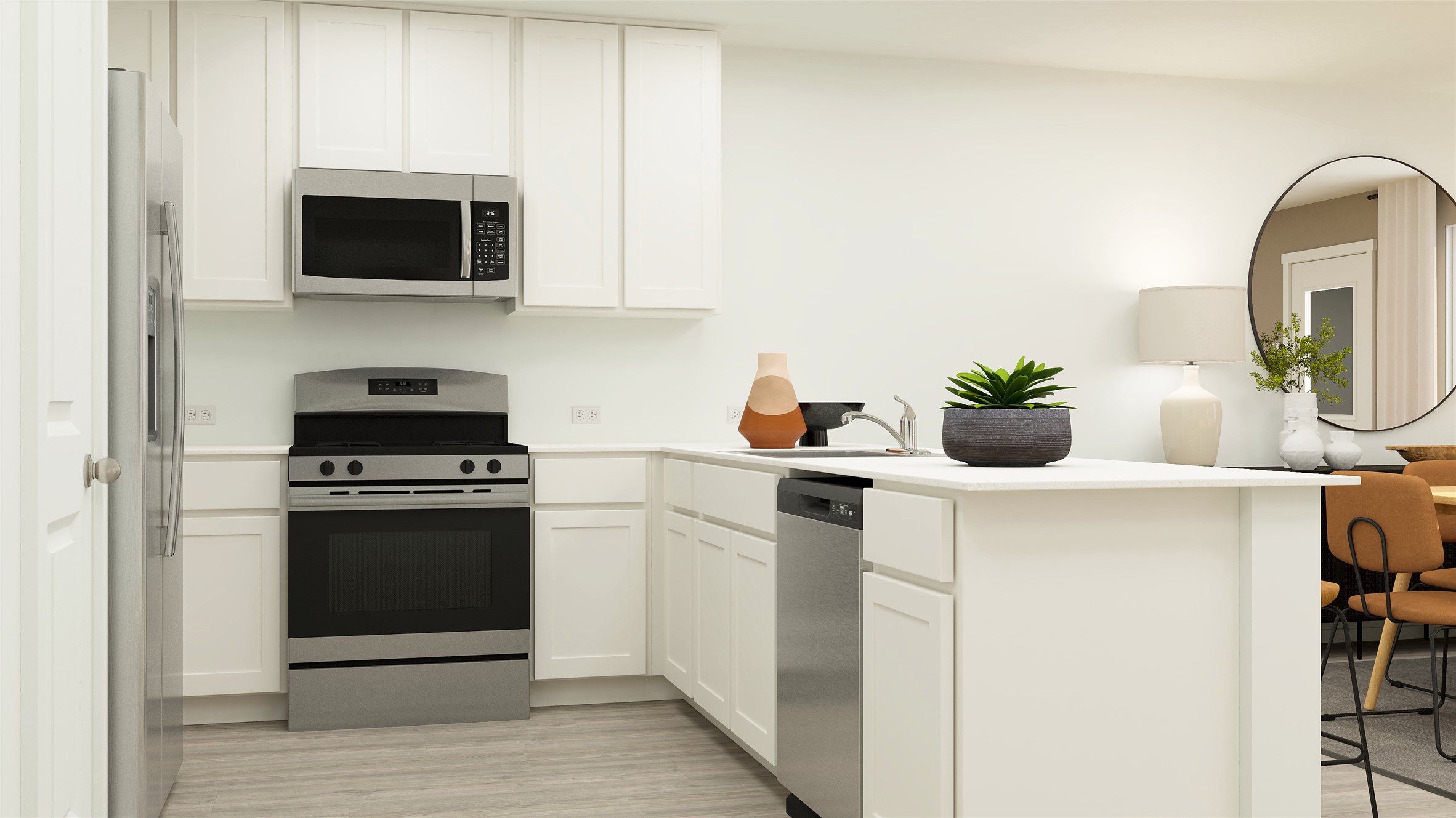 425 Silvercloud Drive Lockhart, TX 78644 - Photo 23 of 30 a kitchen with stainless steel appliances a stove a microwave and a white cabinets