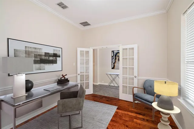 a living room with furniture and a lamp