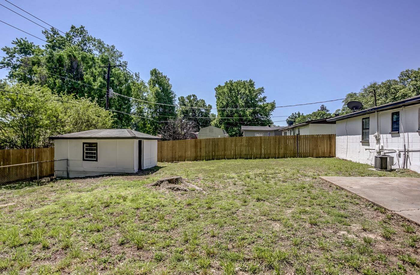 4566 Applegate Road Memphis, TN 38109 - Photo 24 of 25 a backyard of a house with lots of green space