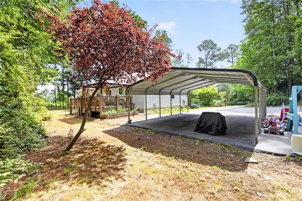 3771 Castleberry Road Cumming, GA 30040 - Photo 44 of 69 a view of a house with a yard and sitting area
