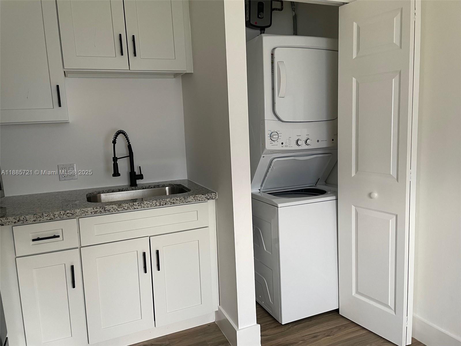 2434 Coolidge Street, Unit FRONT Hollywood, FL 33020 - Photo 11 of 18 a utility room with sink dryer and washer