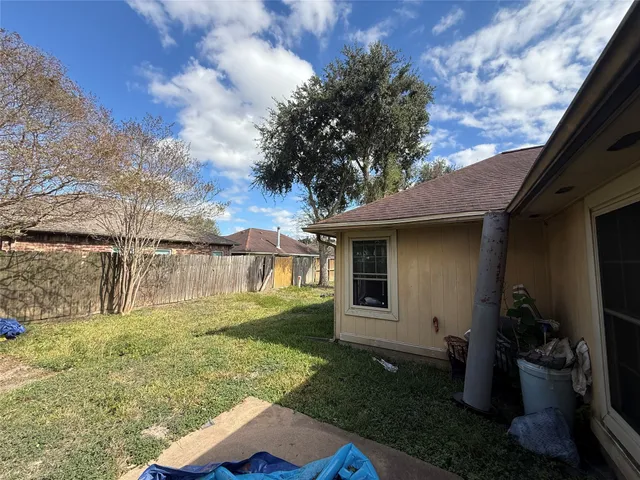 a backyard of a house with lots of green space
