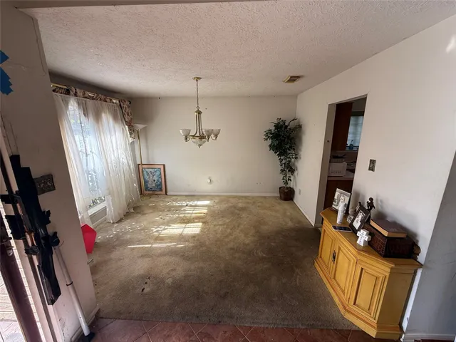 a view of a livingroom with storage & utility room