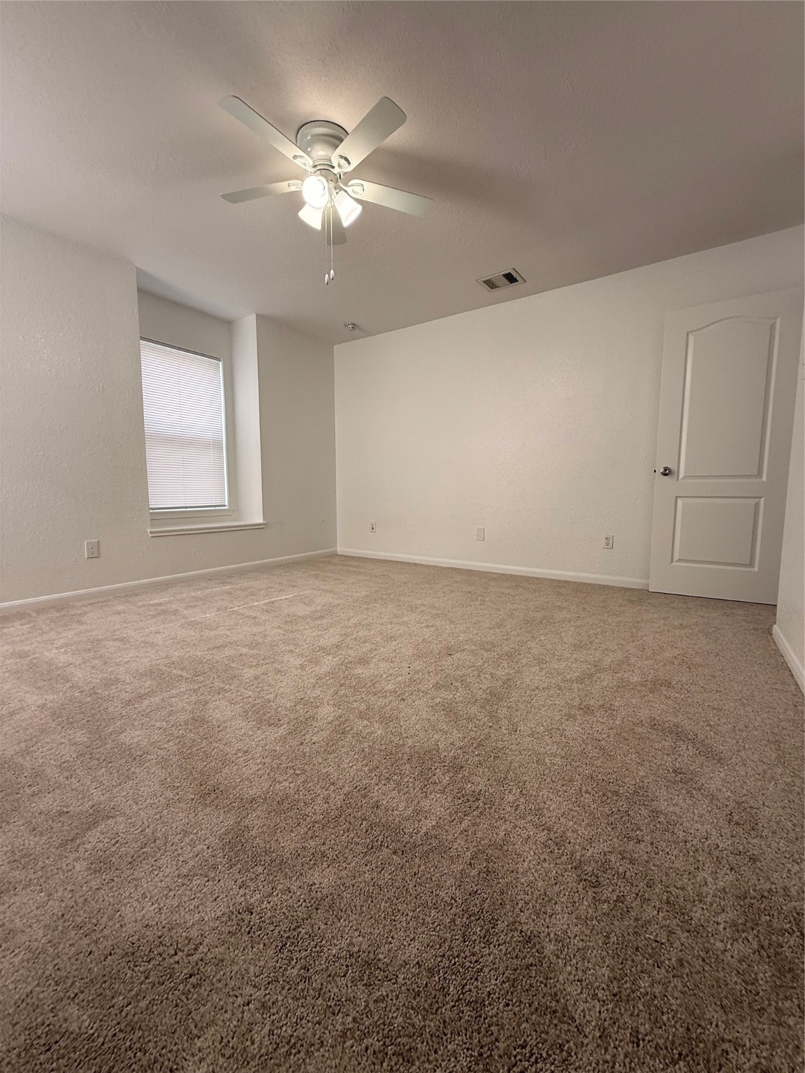 19410 Bold River Road Tomball, TX 77375 - Photo 11 of 25 an empty room with chandelier fan