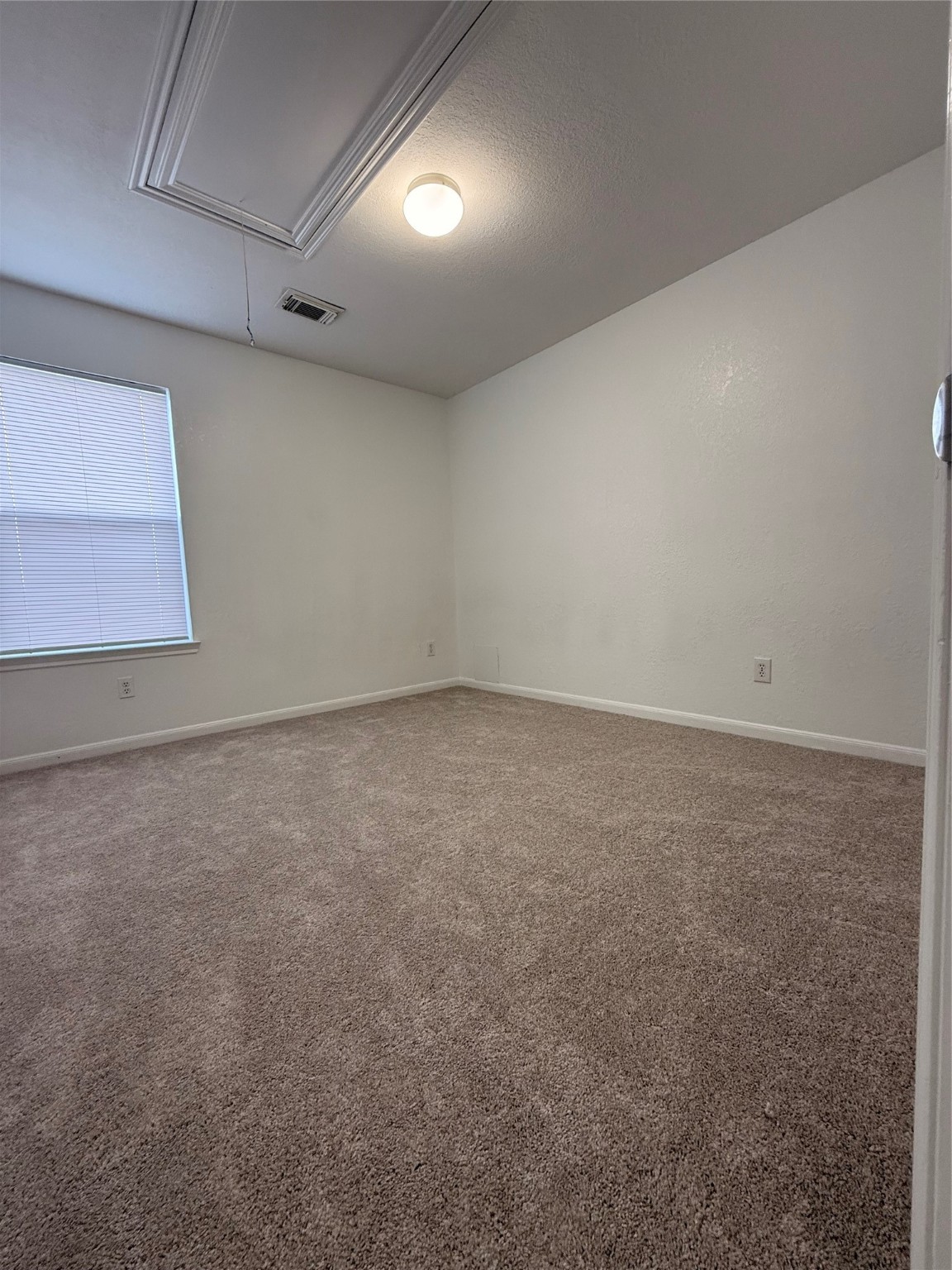 19410 Bold River Road Tomball, TX 77375 - Photo 12 of 25 an empty room with a window