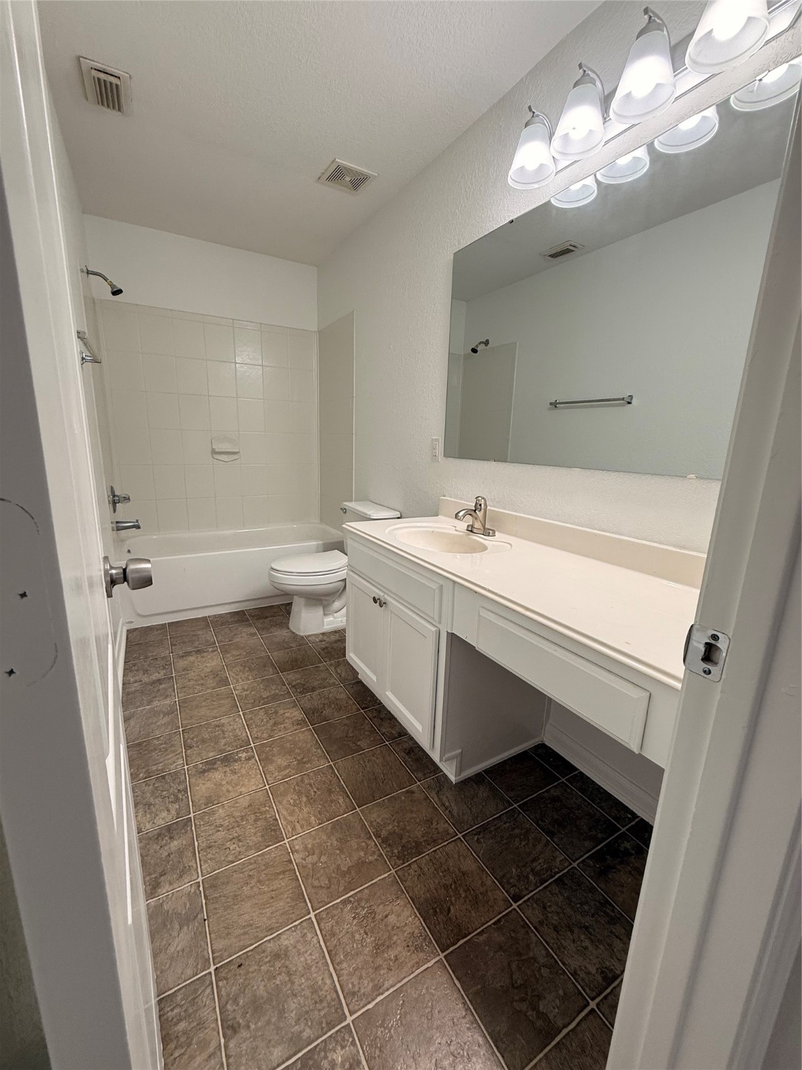 19410 Bold River Road Tomball, TX 77375 - Photo 15 of 25 a bathroom with a sink a toilet and a mirror