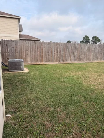 a view of a field with an ocean