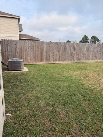 a view of a field with an ocean
