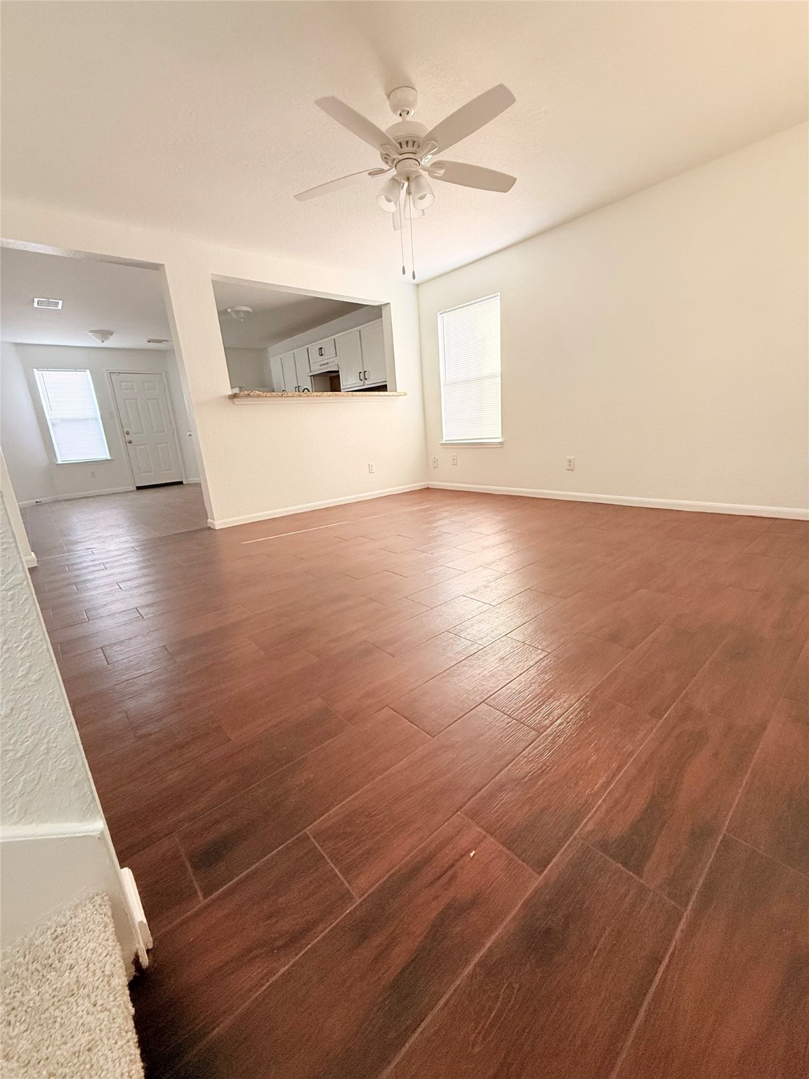 19410 Bold River Road Tomball, TX 77375 - Photo 4 of 25 an empty room with wooden floor and windows