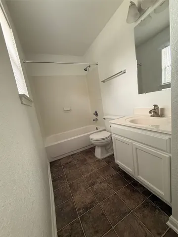 a bathroom with a sink toilet and vanity