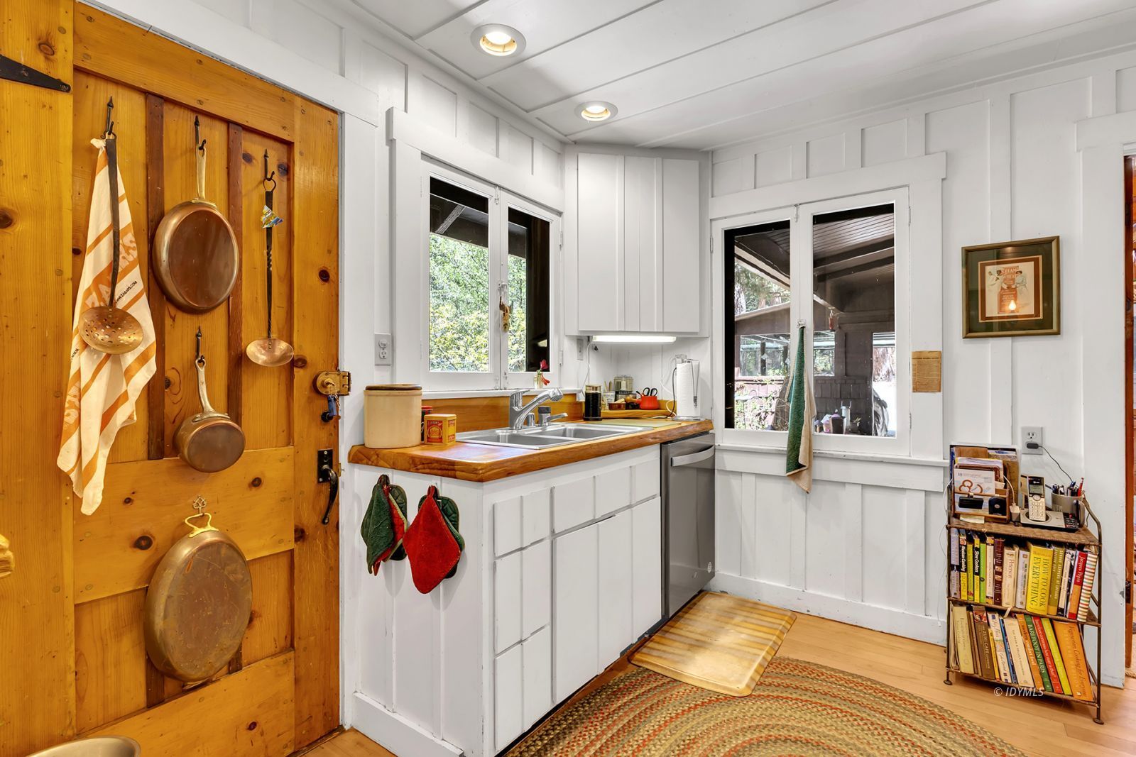 25100 Indian Rock Road Idyllwild, CA 92549 - Photo 25 of 75 a kitchen with stainless steel appliances granite countertop a stove a sink and a refrigerator