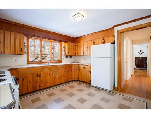 96 Roy Street Springfield, MA 01104 - Photo 12 of 27 a kitchen with sink a refrigerator and cabinets