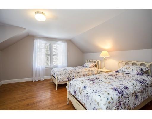 96 Roy Street Springfield, MA 01104 - Photo 19 of 27 a bedroom with a bed and wooden floor
