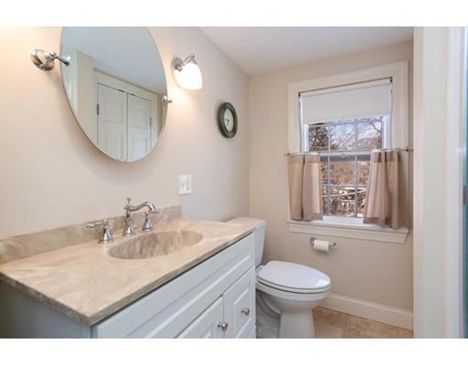 96 Roy Street Springfield, MA 01104 - Photo 20 of 27 a bathroom with a toilet a sink a mirror and a window