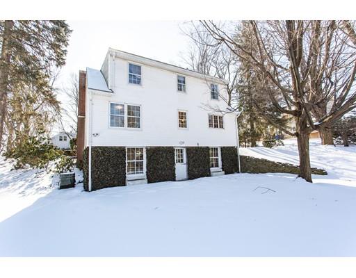 96 Roy Street Springfield, MA 01104 - Photo 2 of 27 a view of a house with a yard and garage