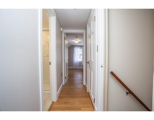 96 Roy Street Springfield, MA 01104 - Photo 21 of 27 a view of a hallway with wooden floor