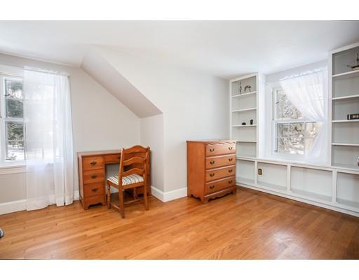 96 Roy Street Springfield, MA 01104 - Photo 22 of 27 a view of a bedroom with furniture and windows