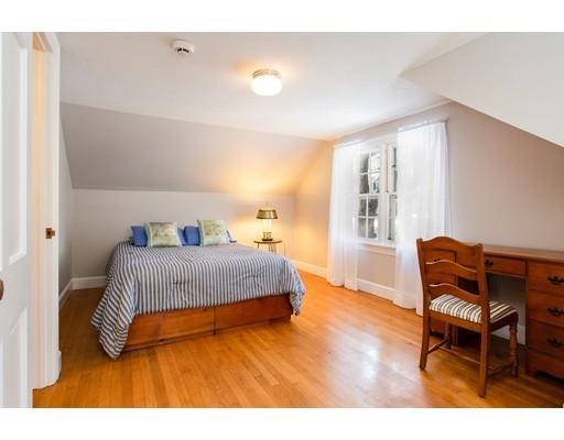 96 Roy Street Springfield, MA 01104 - Photo 23 of 27 a bedroom with a bed a chair and a potted plant