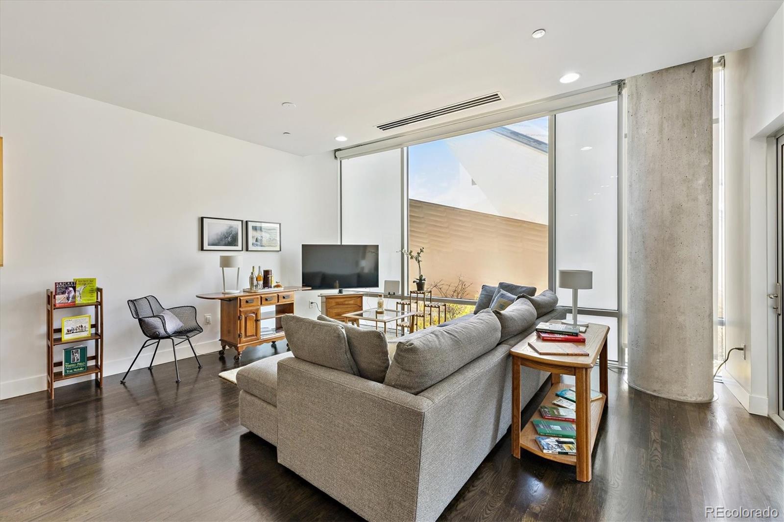 1200 Acoma Street, Unit 303 Denver, CO 80204 - Photo 14 of 48 a living room with furniture and a large window