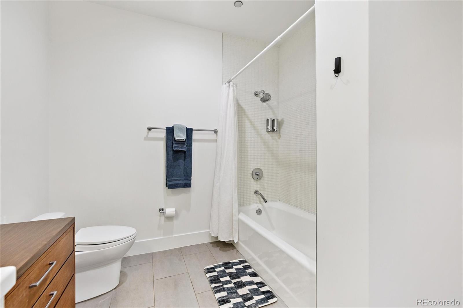 1200 Acoma Street, Unit 303 Denver, CO 80204 - Photo 22 of 48 a bathroom with a toilet and a shower