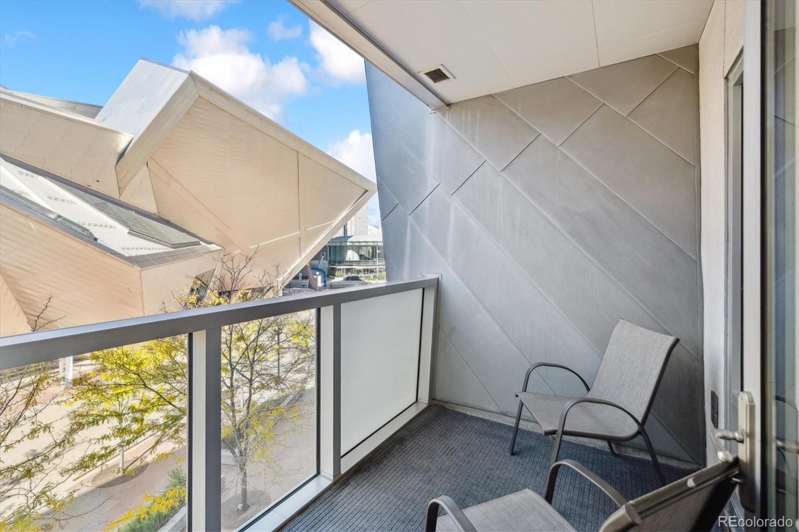 1200 Acoma Street, Unit 303 Denver, CO 80204 - Photo 23 of 48 a view of a chair and table in the balcony