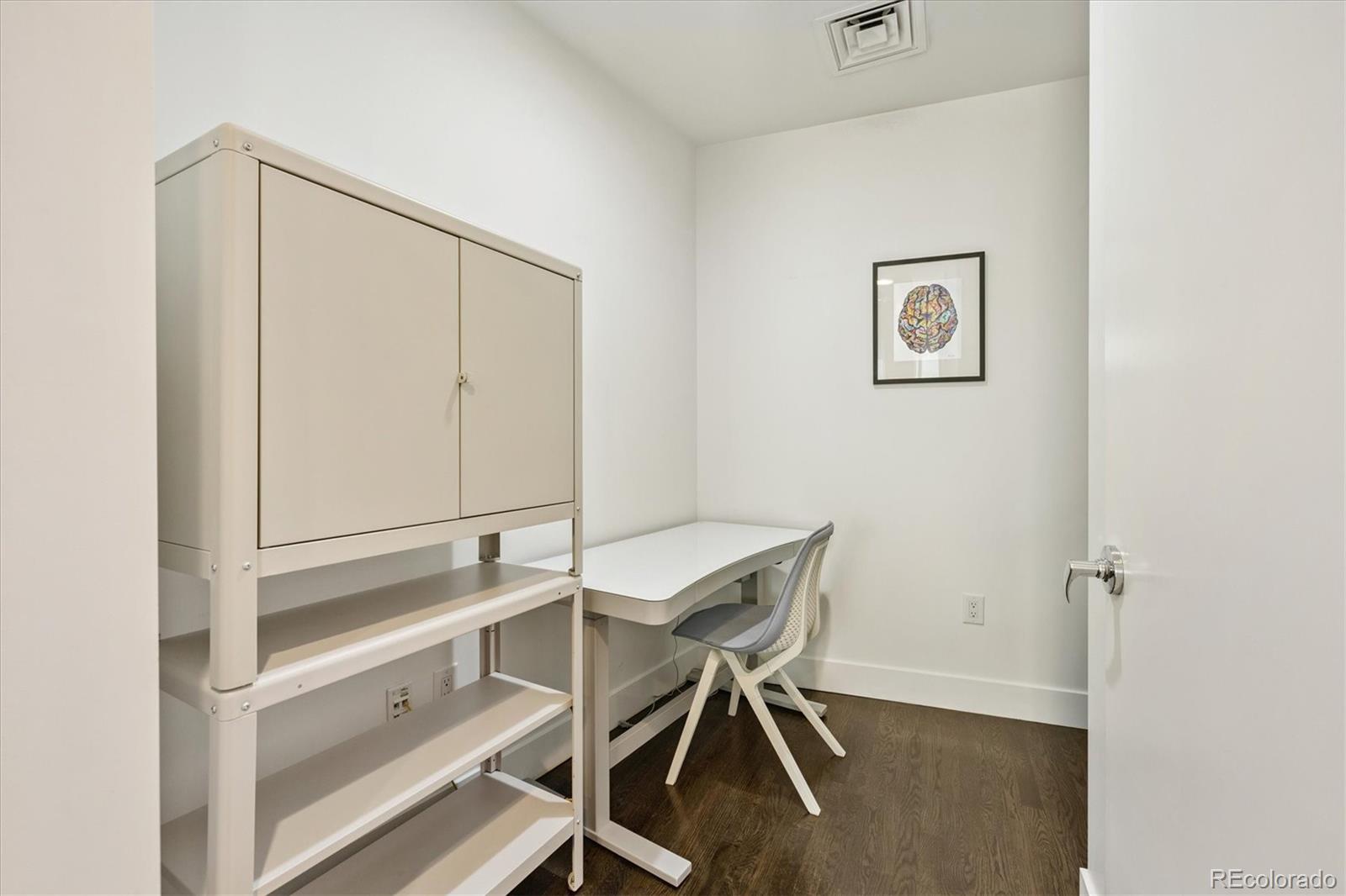 1200 Acoma Street, Unit 303 Denver, CO 80204 - Photo 25 of 48 a room with table and white walls