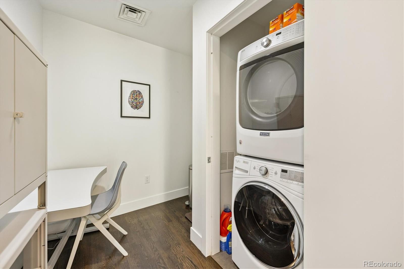 1200 Acoma Street, Unit 303 Denver, CO 80204 - Photo 26 of 48 a view of a storage and utility room with wooden floor