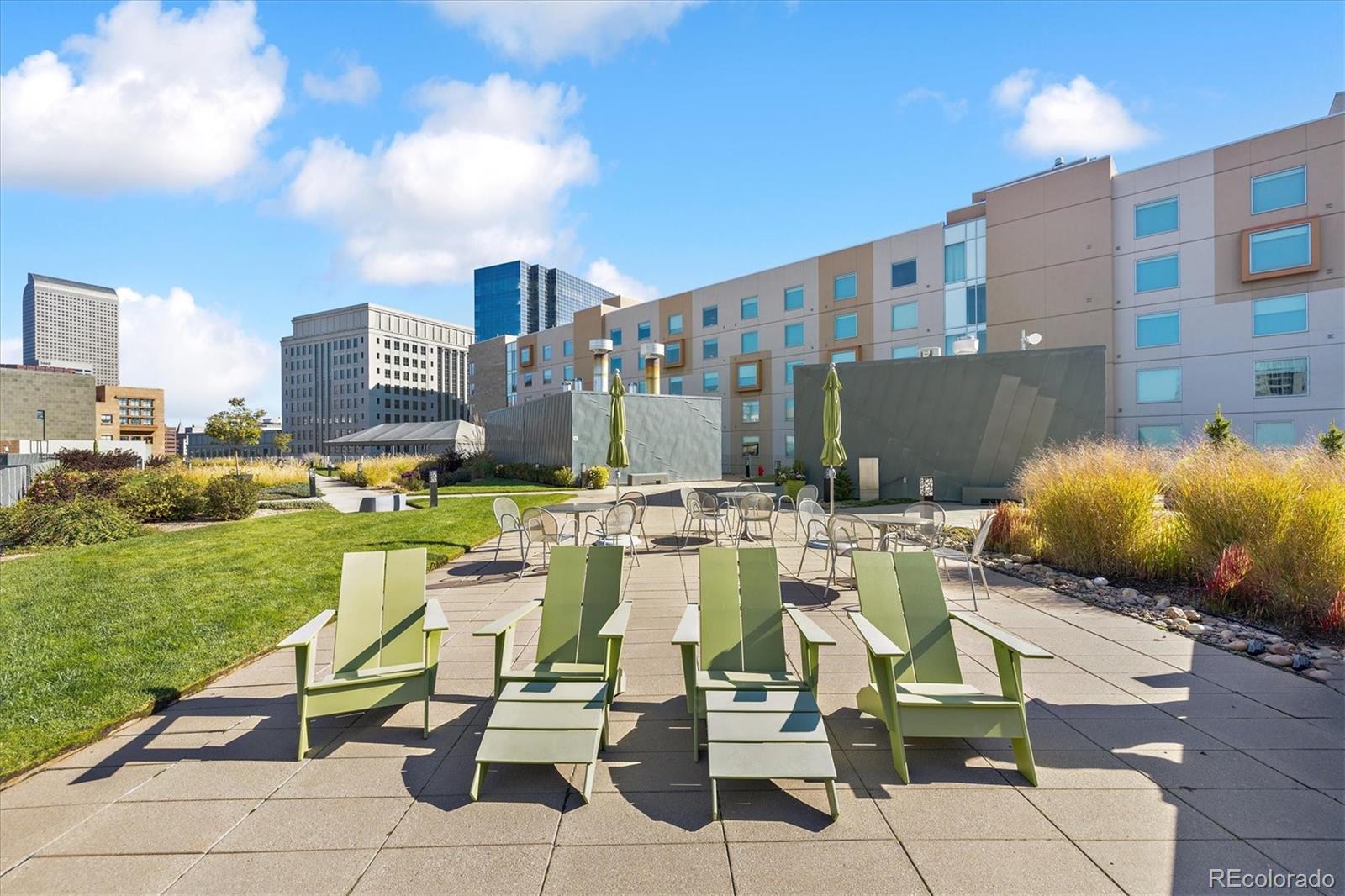 1200 Acoma Street, Unit 303 Denver, CO 80204 - Photo 29 of 48 a view of yard with outdoor seating and city view