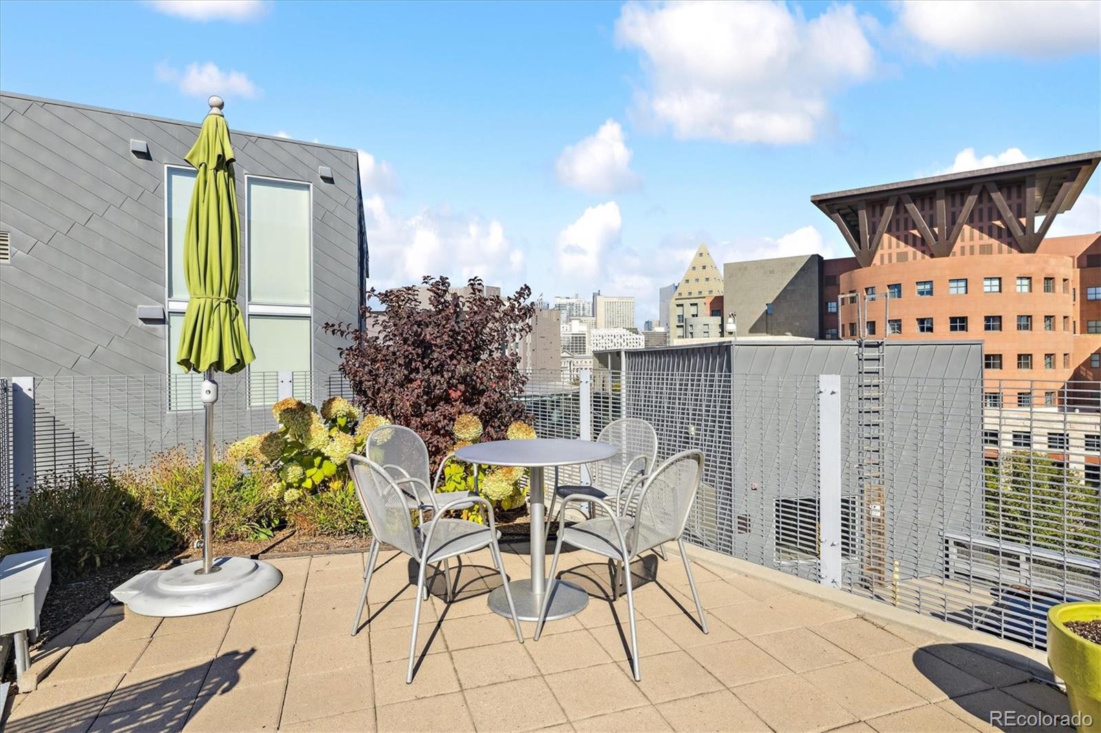 1200 Acoma Street, Unit 303 Denver, CO 80204 - Photo 31 of 48 a view of a chairs and table in patio